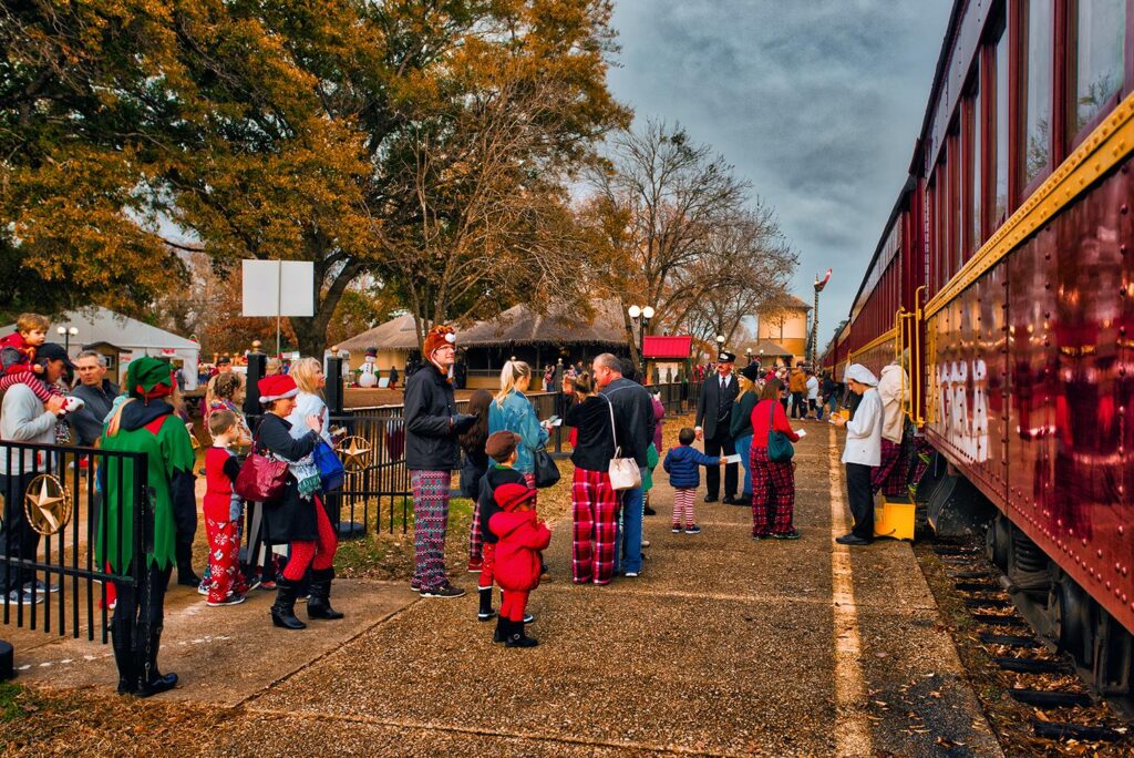 Passengers wait patiently to board the train.